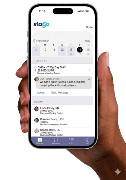 Hand holding a phone showing the Stogo shift management app